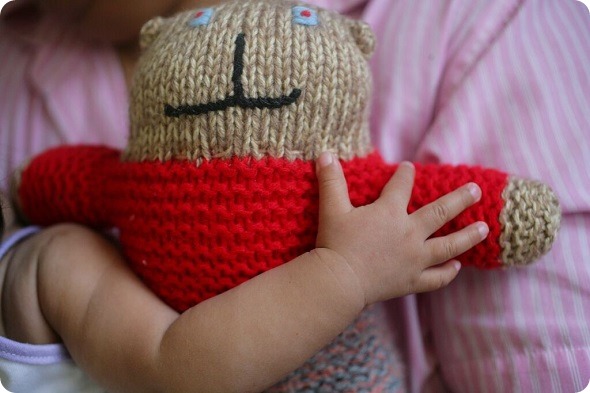Child holding a teddy bear