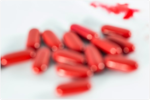 Blur medicine of danger eating counterfeit drugs, Image Copyright: Theerapakorn / Shutterstock