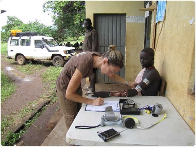University of Pennsylvania researchers studied the genetics behind skin pigmentation of diverse African populations, finding new genetic variants associated with skin color. Here, senior research scientist Alessia Ranciaro measures the skin reflectance of a man from a Nilo-Saharan group. Members of this population tend to have very dark skin pigmentation.