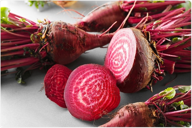 Fresh young sliced beets on table