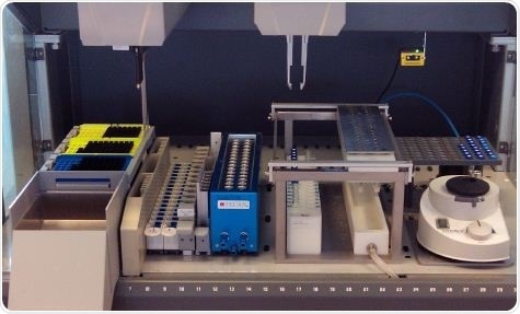 Photo of the Tecan Freedom EVO positive pressure SPE workstation. The image shows the configurable parts of the worktable used by researchers for this study.