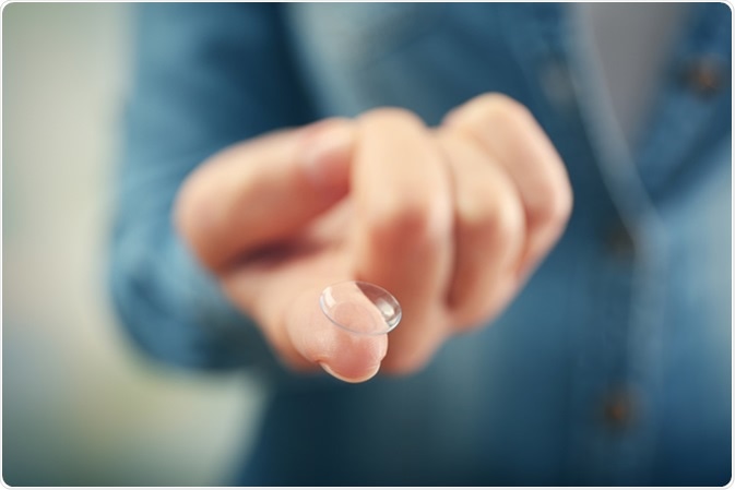 Contact lens on female finger, close up view. Image Credit: Africa Studio / Shutterstock