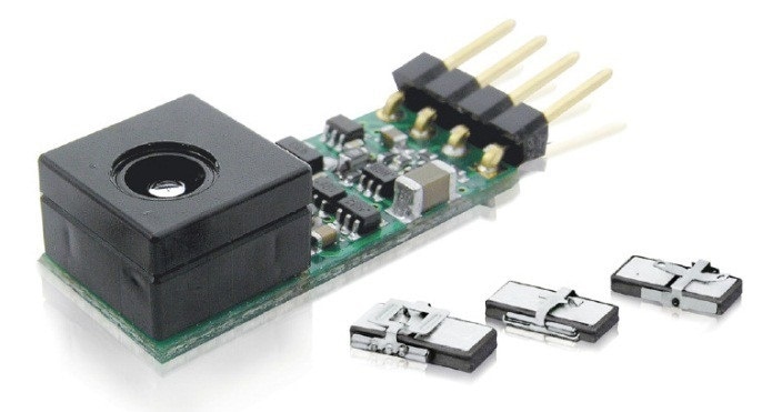 A miniature piezo motor positions an autofocus lens integrated along with the driver on a small PCB.