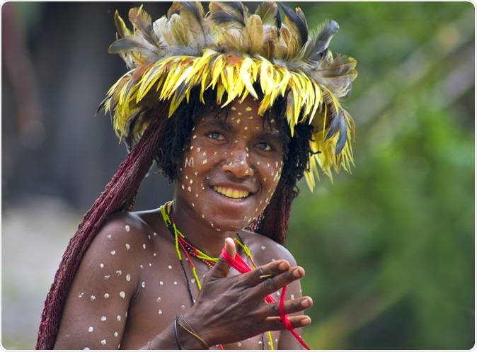 Woman of a Papuan tribe in traditional clothes and coloring in New Guinea Island. Image Credit: Byelikova Oksana / Shutterstock