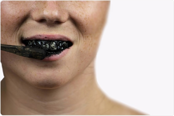 Black tooth paste with active charcoal. Image Credit: Cerrophoto / Shutterstock
