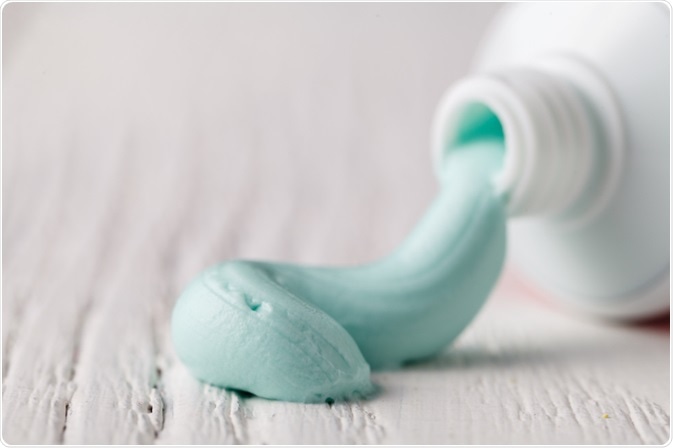 Toothpaste tube and paste - photo by Tasha Cherkasova