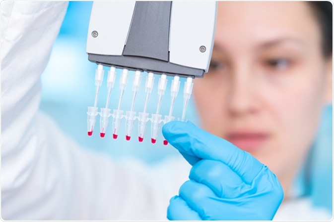 Technician with multipipette in genetic laboratory PCR research. Image Credit: Science Photo / Shutterstock