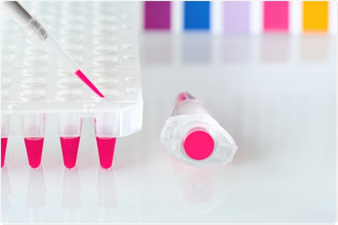 Pipette and eppendorf tubes containing sample of DNA labelled with pink dye.