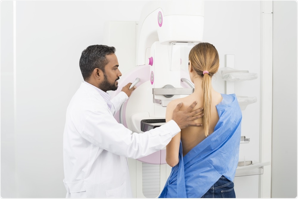 Woman undergoing mammography - breast cancer screening