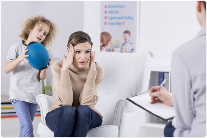 Mother of ADHD child talking with psychologist. Image Credit: Photographee.eu / Shutterstock