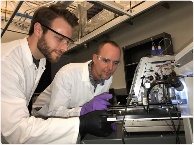 Tyler Lambeth (left) and Ryan Julian in the lab. Image Credit: Julian lab, UC Riverside