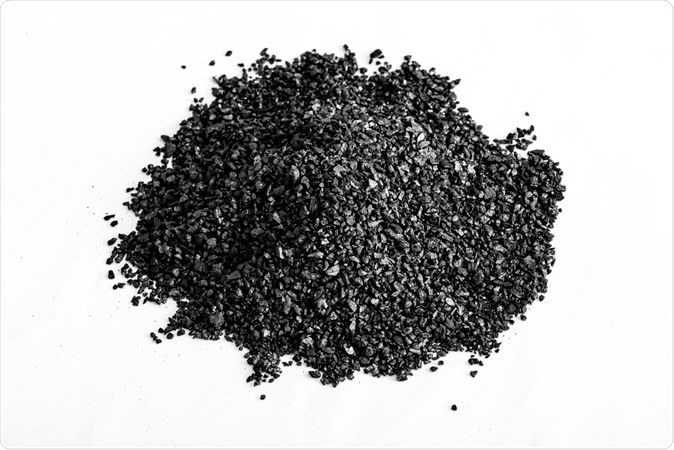 Black activated carbon granules. Image Credit: HelloRF Zcool / Shutterstock