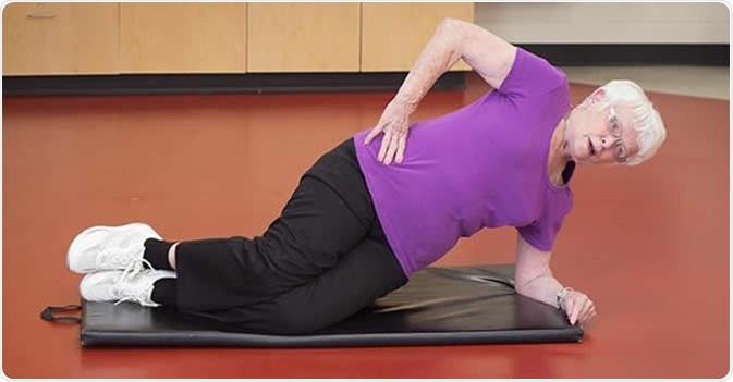 ACE pilot study takes cancer rehab to the community, Betty Wood works her lower body at one of the exercise stations during her ACE class at the Don Wheaton Family YMCA. Image Credit: University of Alberta