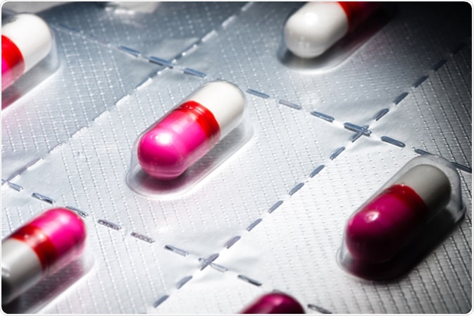 Pink antihistamine capsules in blister pack Image Credit: EHStockphoto / Shutterstock