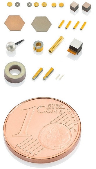 Variety of miniaturized piezo transducers, 1 cent coin used for size comparison