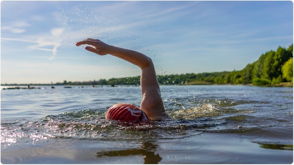 Woman swimming in freshwater lake