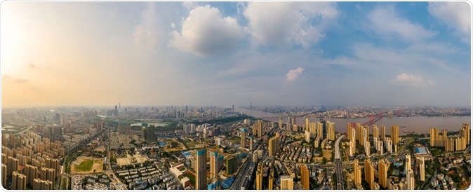 Wuhan skyline and Yangtze river with supertall skyscraper under construction in Wuhan Hubei China. Image Credit: Sleepingpanda / Shutterstock