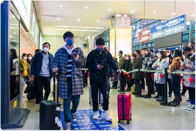 Chengdu, Sichuan / China - January 23 2019: travellers all wear mask at airport to prevent infection from coronavirus. The virus has caused emergency situation during Chinese New Year. Image Credit: B.Zhou / Shutterstock