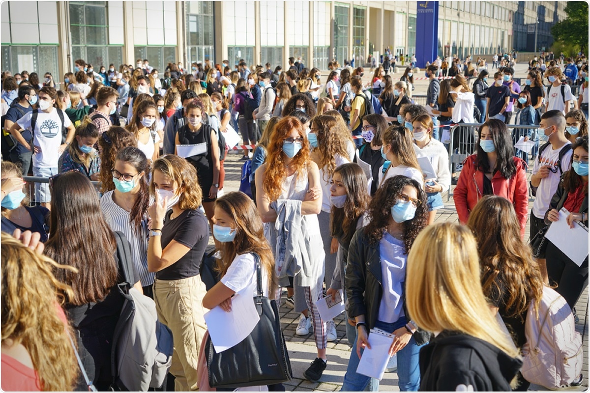 Students queuing at the school entrance. Turin, Italy - September 2020. Image Credit: Mike Dotta / Shutterstock