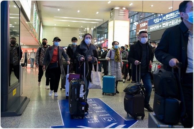 Chengdu, Sichuan / China - Travellers wear masks at airport to prevent infection from coronavirus. Image Credit: B.Zhou / Shutterstock