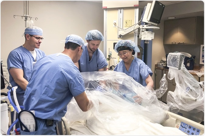 Dr. Matthew Ellison, Dr. Kevin McKillion, Dr. Hong Wang and CRNA Cole Mortellaro, the WVU Medicine anesthesia team practice COVID-19 intubations using the intubation box created in the Innovation Hub. The suite was set up by the trauma and critical care institute specifically for COVD-19 practice in the hospital. Intubation boxes help decrease aerosol spread from infected patients. (WVU Photo)