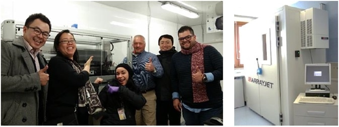 Team of extremely satisfied Arrayjet customers (left) after the Ultra Marathon II installation in Baltimore, USA.  TheUltra Marathon II (right) is enclosed within the JetMosphere MaxTM environmental control unit to enable ultra low temperature printing.