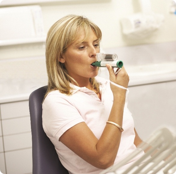 Dental patient using the green whistle