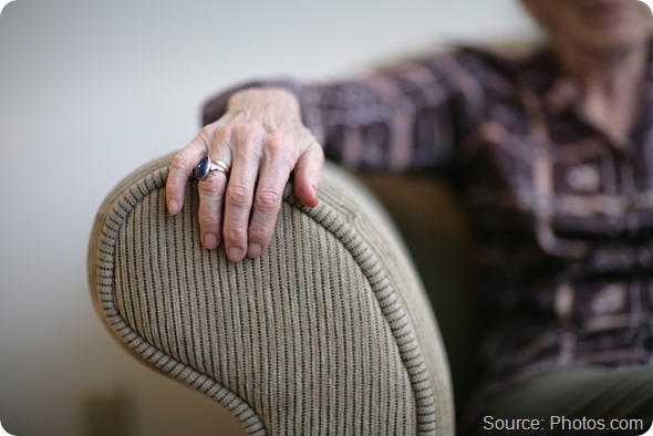 Senior woman hand on an armrest