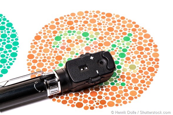 Ophthalmoscope is on a Ishihara color vision test chart