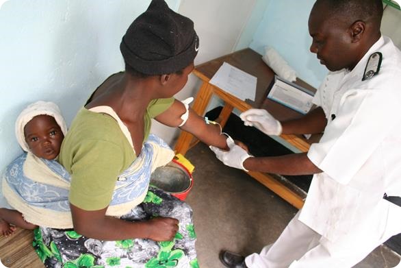 An MSF nurse takes a sample of blood from an HIV+ patient, for monitoring the health of the patients immune system, and the effectiveness of their anti-retroviral treatment. This monitoring of blood samples is done every 3-6 months.