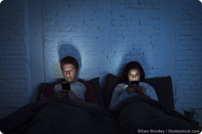 social media in bed couple