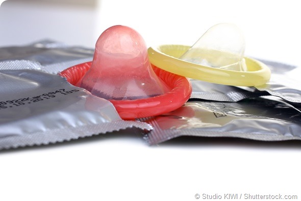 two open condoms and sealed condoms