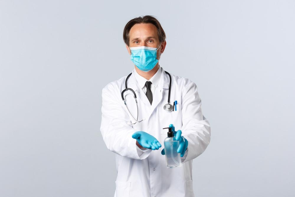 Healthcare worker with sanitizer