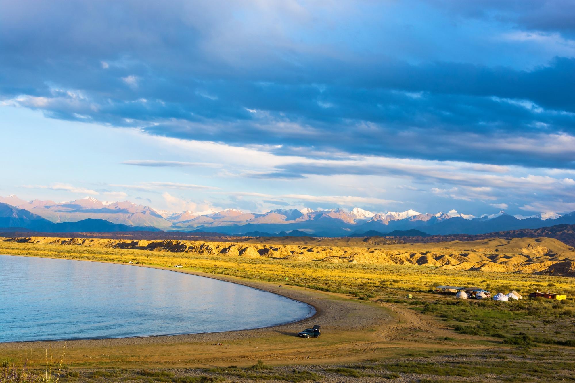Lake Issyk-Kul in the summer day, Kyrgyzstan. Image Credit: V. Smirnov / Shutterstock