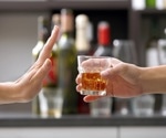 What is the optimal alcohol consumption level to minimize health loss?