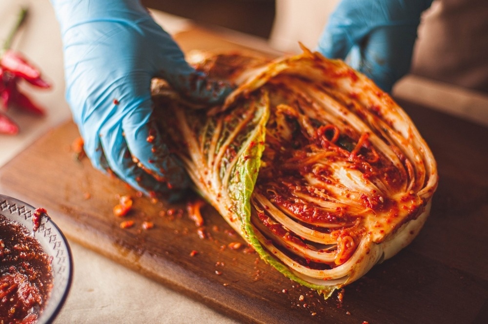 What are the results of kimchi on human well being?
