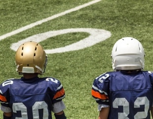 The impact of tackle football on adolescent brain structure and function